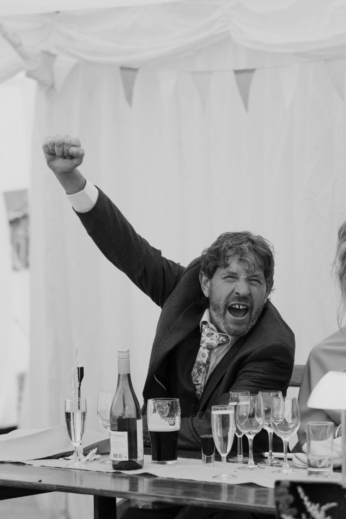 Cheering best man in black and white