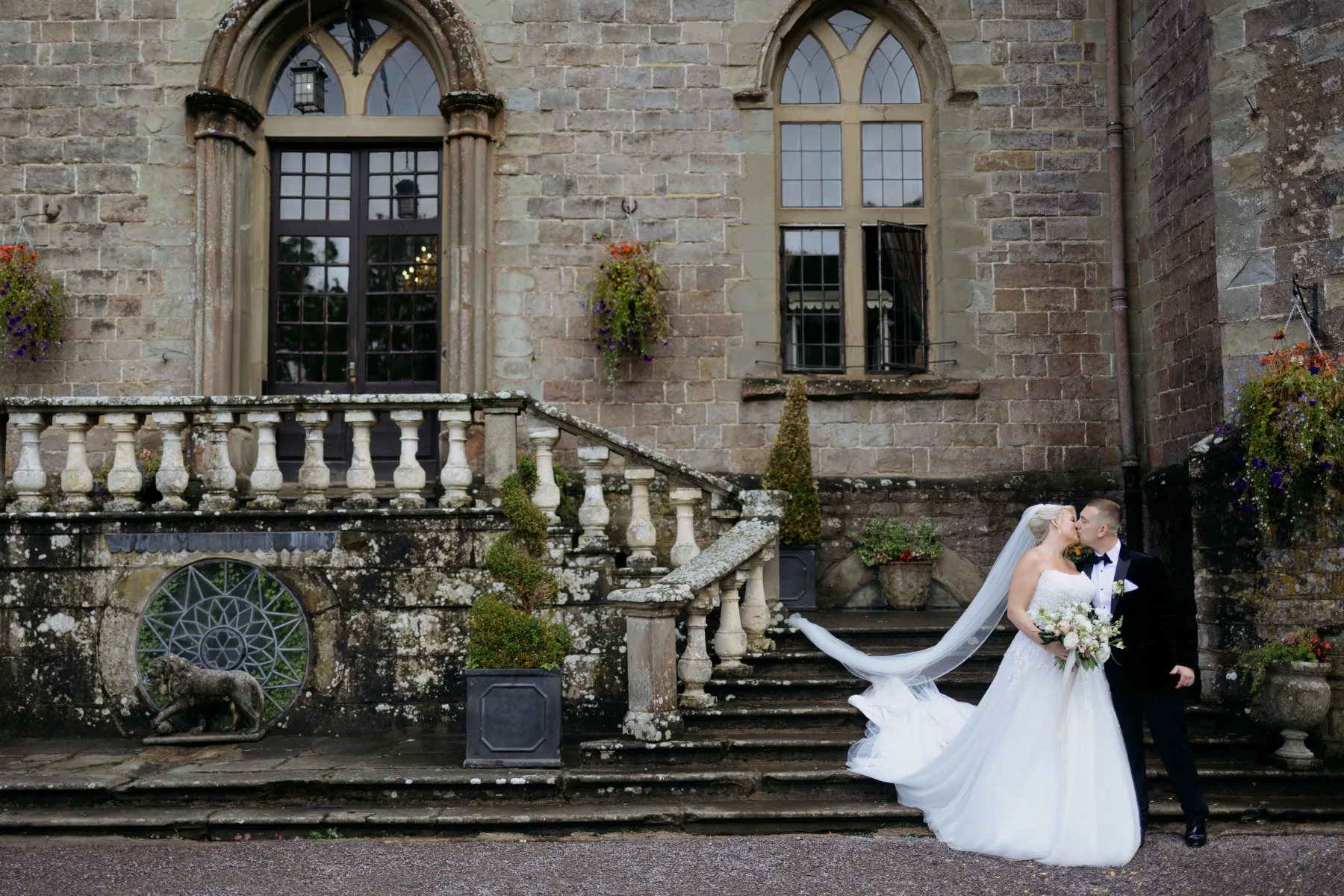 Newlyweds outside Clearwell Castle in the Forest of Dean
