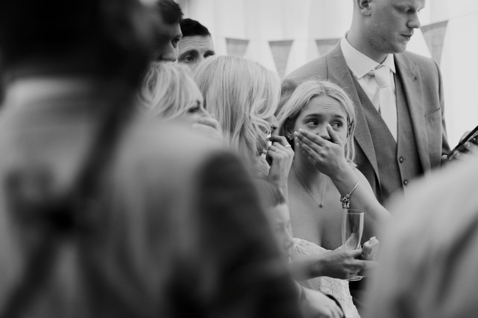 Emotional wedding guest in black and white