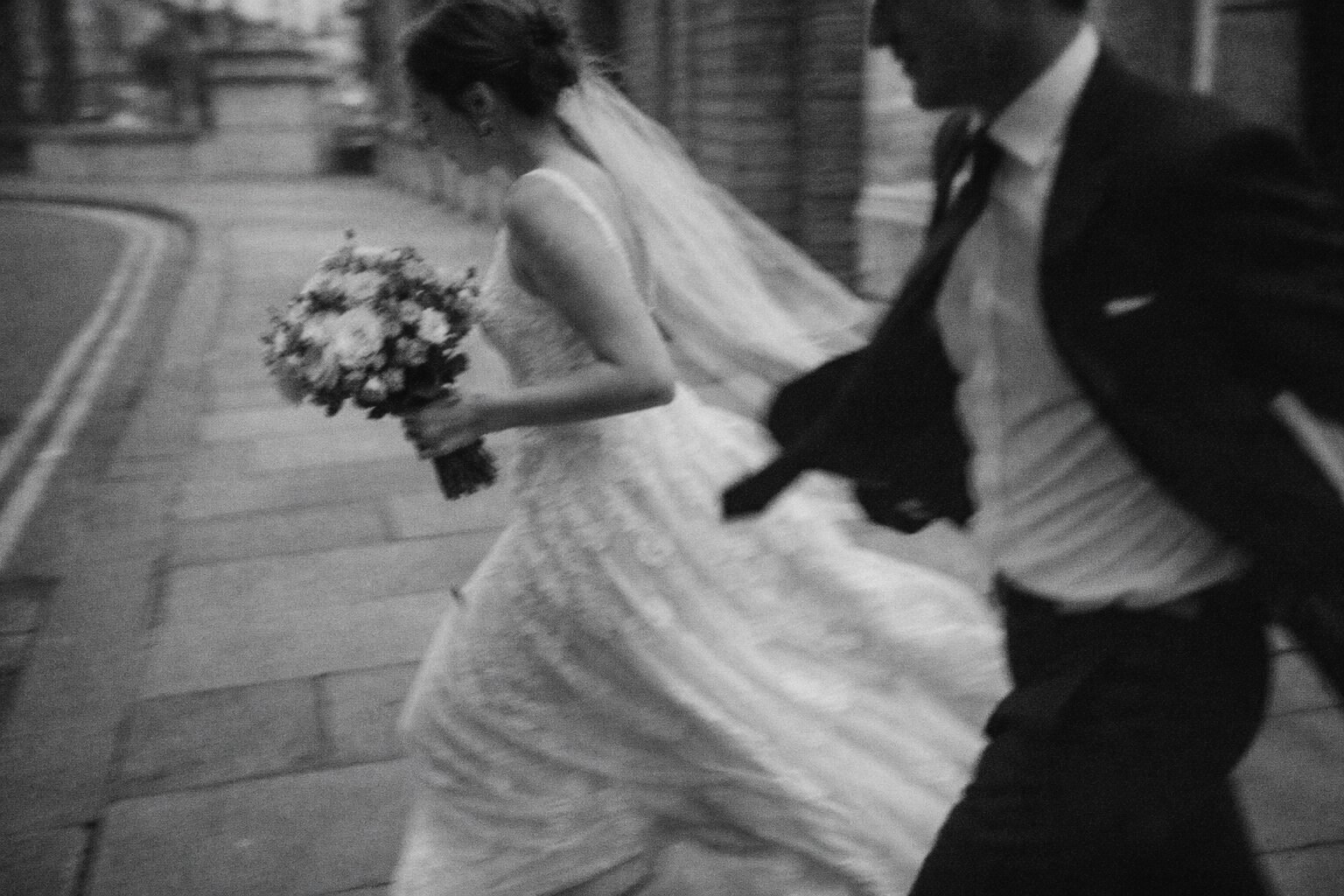 Newlyweds celebrating together at a relaxed countryside wedding