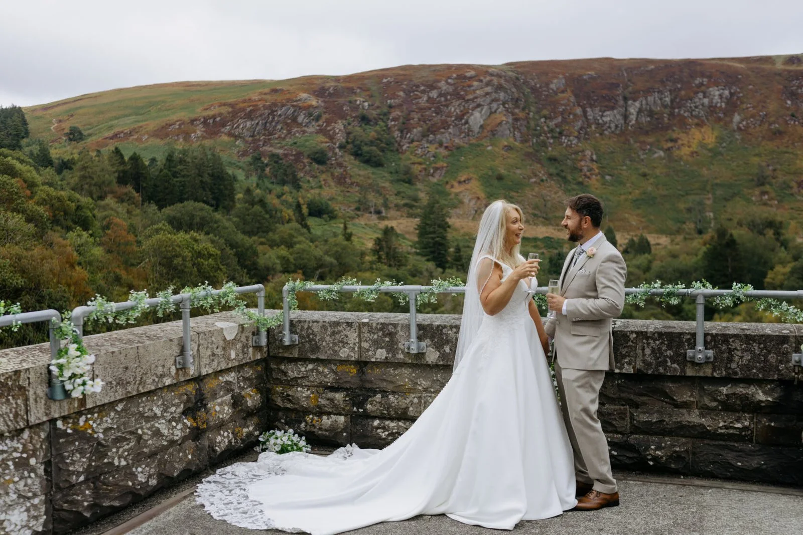 Newlyweds on a stone bridge in the Elan Valley