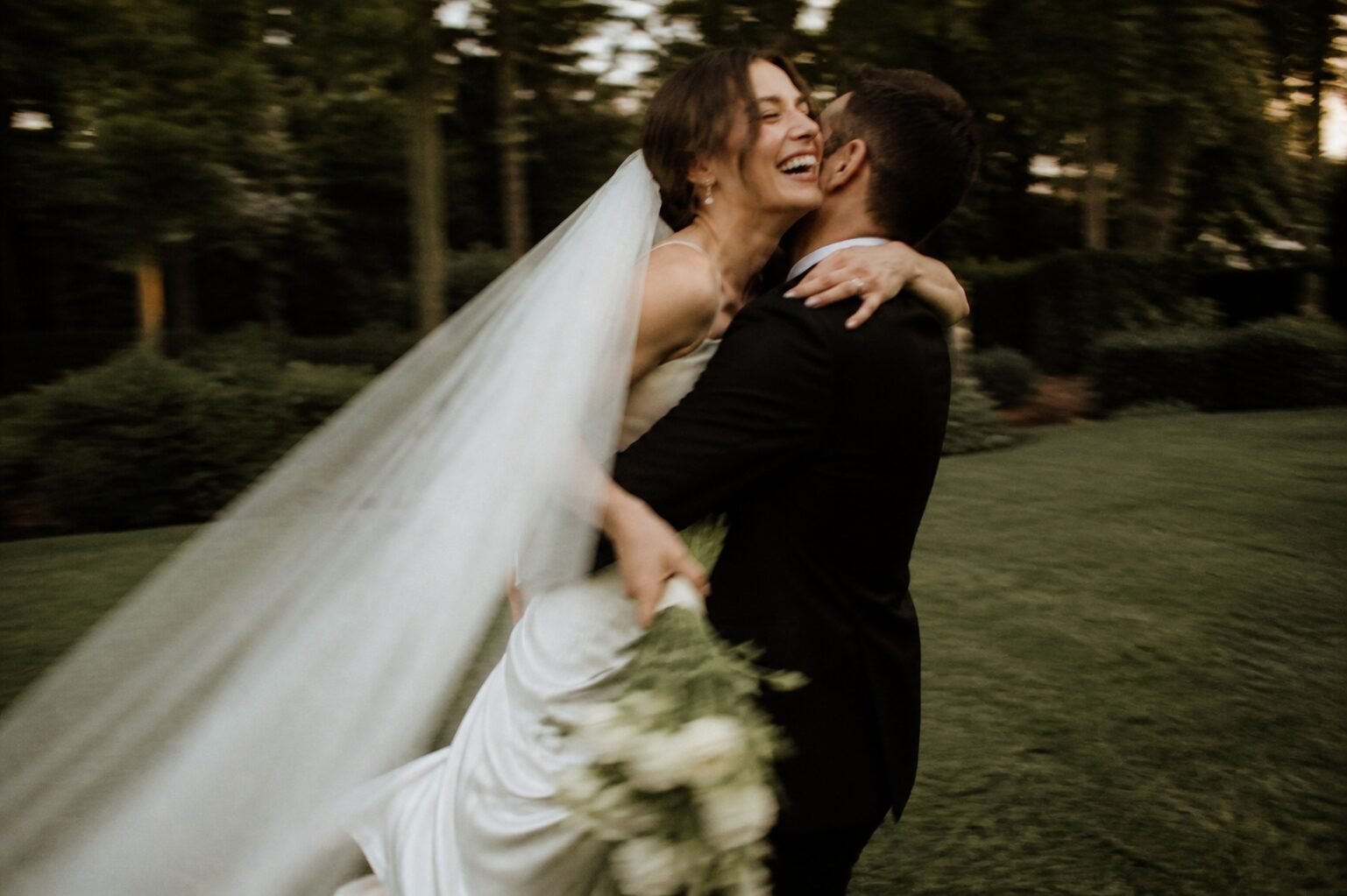 Newlyweds spinning woodland