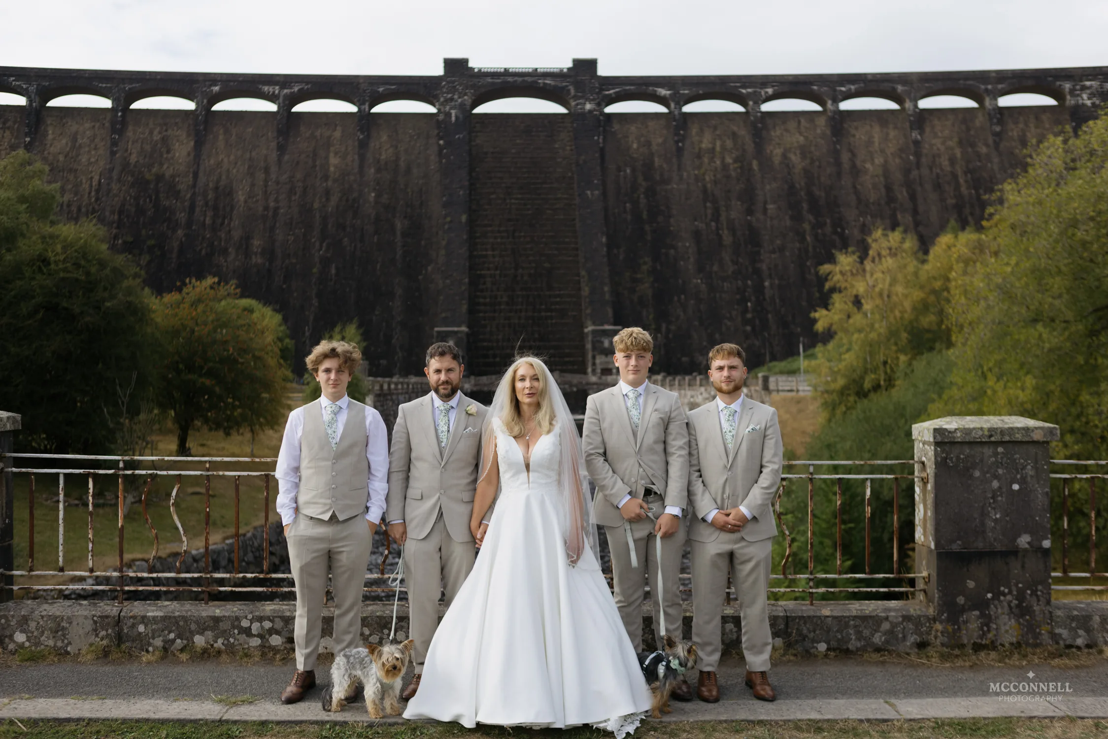 Debi and Ryan with their family and dogs in front of Pen y Garreg Dam