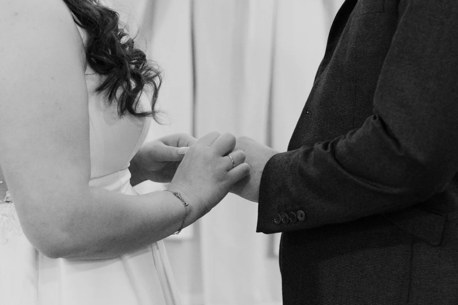 Wedding ring exchange in black and white